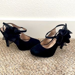 Black suede heels with flower